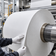 Technician inspecting a specialty paper roll during production